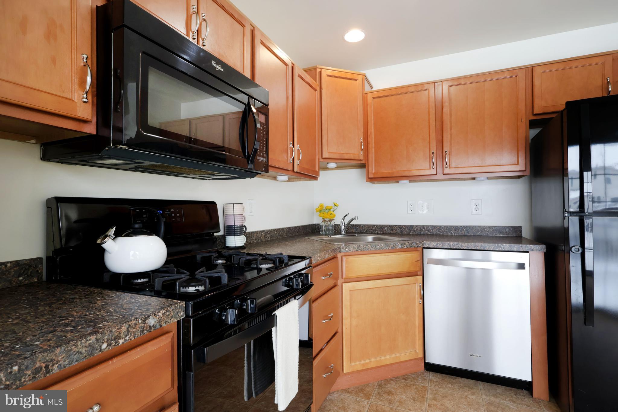 123 Exeter Lane Bellefonte, PA 16823 - Photo 10 of 49 a kitchen with a stove and a microwave