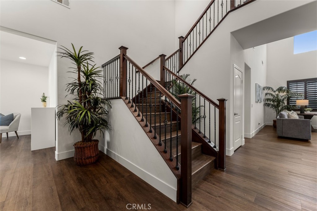 14977 Brooktree Street Eastvale, CA 92880 - Photo 14 of 34 a view of entryway with wooden floor and stairs