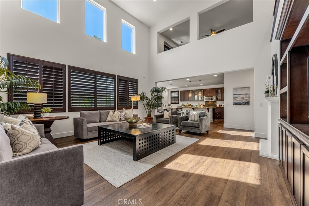 14977 Brooktree Street Eastvale, CA 92880 - Photo 4 of 34 a living room with furniture and a flat screen tv
