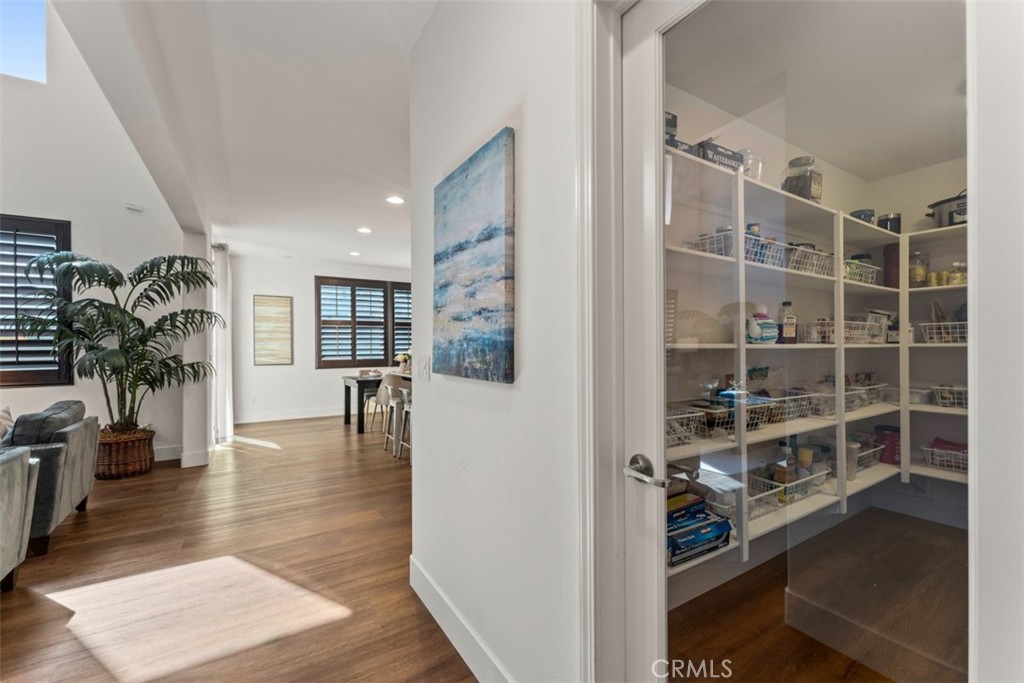 14977 Brooktree Street Eastvale, CA 92880 - Photo 9 of 34 a view of a living room and entryway in a room