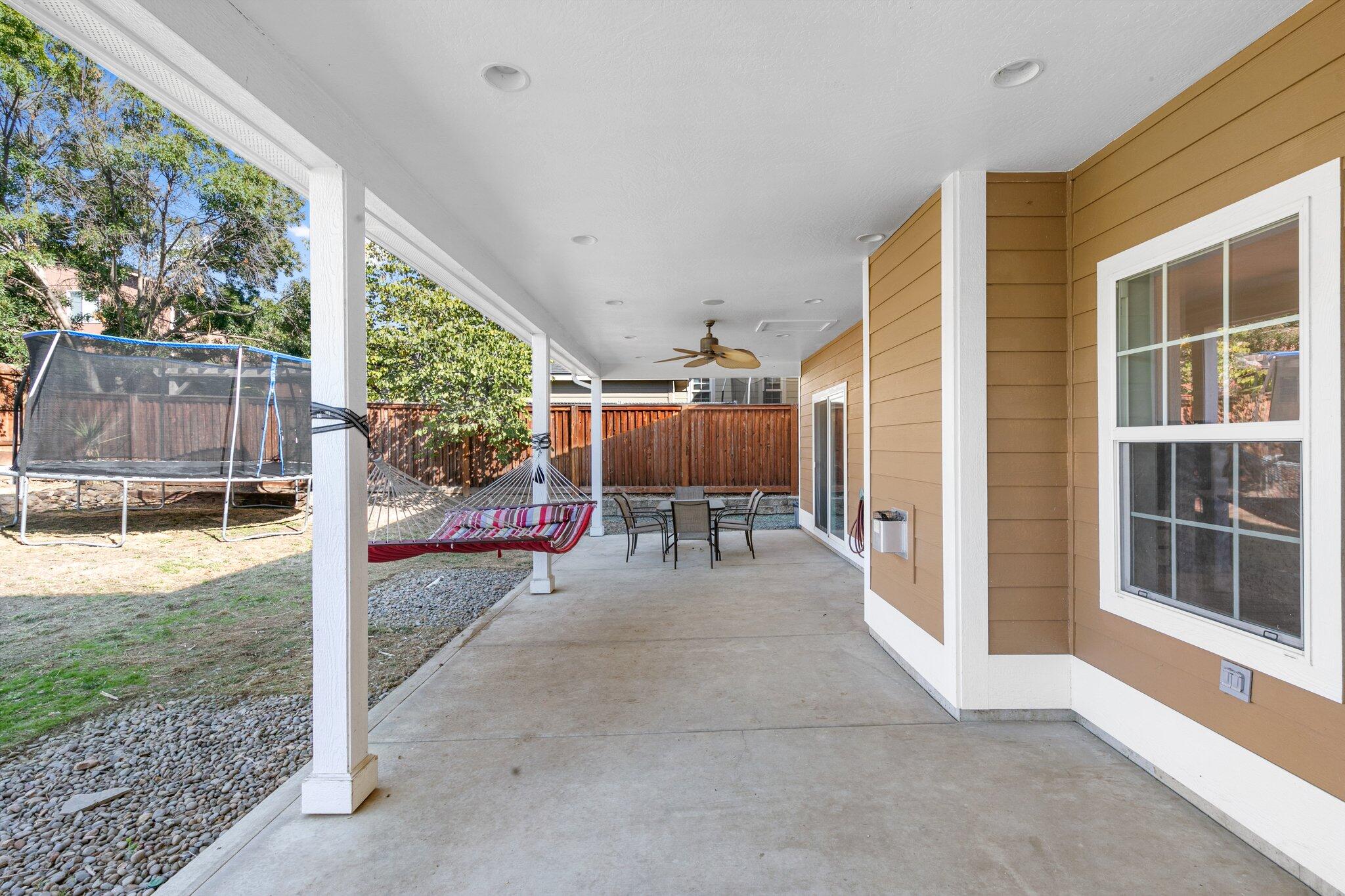 1965 Rabun Way Central Point, OR 97502 - Photo 44 of 47 a view of a porch with chairs and backyard