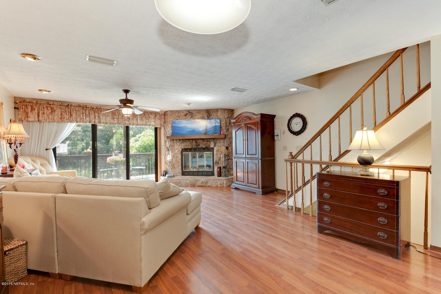 2007 Seminole Road Atlantic Beach, FL 32233 - Photo 3 of 18 a living room with furniture a fireplace and a large window