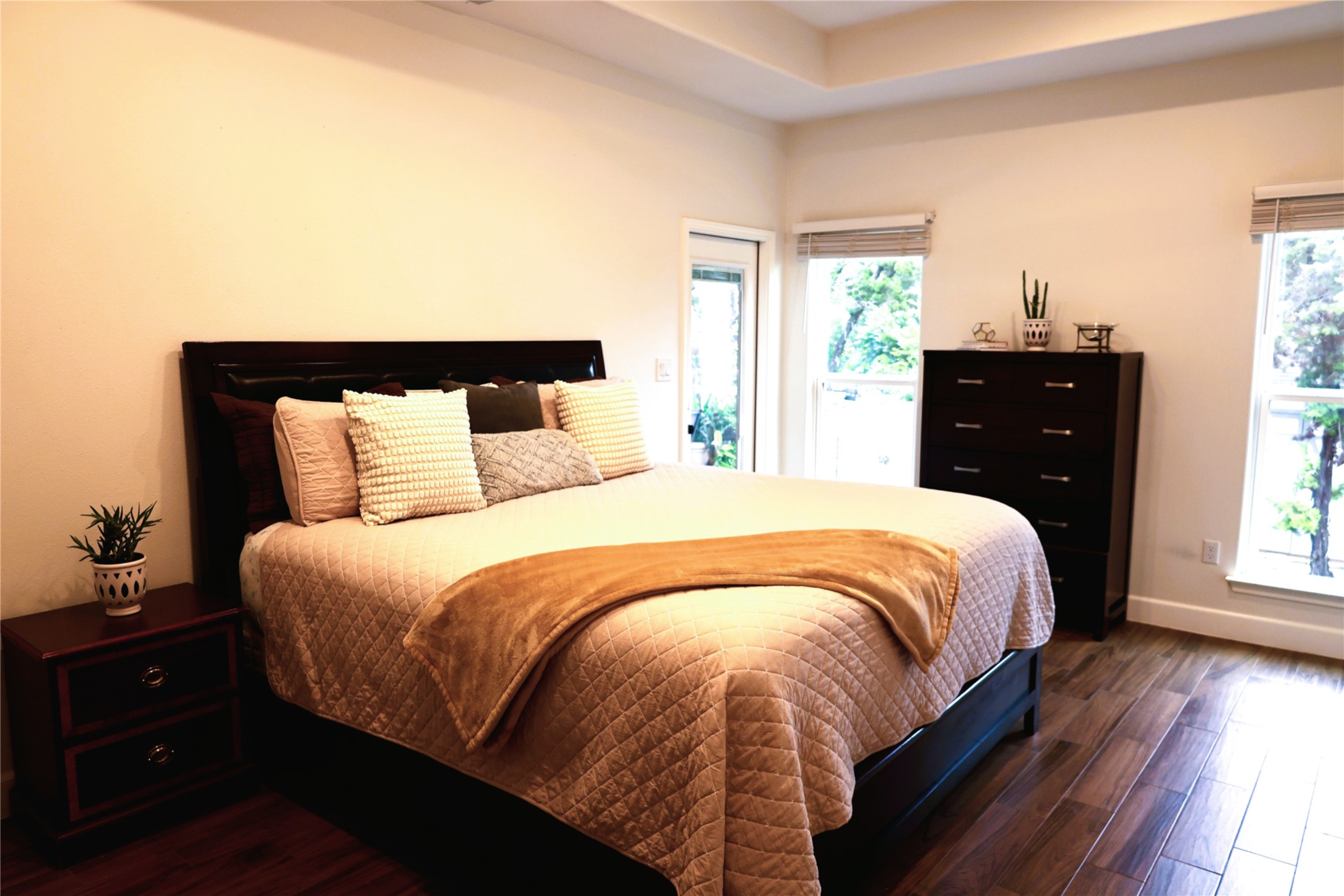 20602 Oak Ridge Lago Vista, TX 78645 - Photo 12 of 35 Rich wood plank floors and a tray ceiling define this elegant private bedroom retreat.