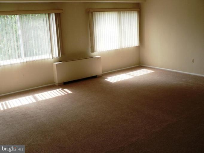 1111 University Boulevard West, Unit 413A Silver Spring, MD 20902 - Photo 11 of 14 an empty room with a window