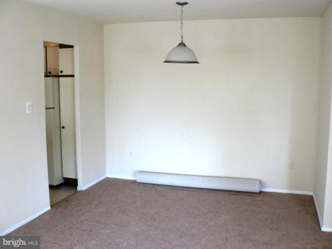 1111 University Boulevard West, Unit 413A Silver Spring, MD 20902 - Photo 4 of 14 a view of an empty room with a window
