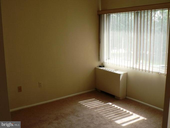 1111 University Boulevard West, Unit 413A Silver Spring, MD 20902 - Photo 6 of 14 a room with a window