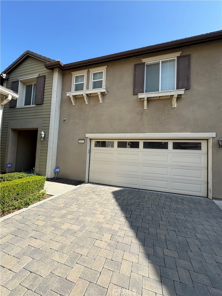 1502 Beacon Upland, CA 91786 - Photo 1 of 1 a view of a house with a yard and garage