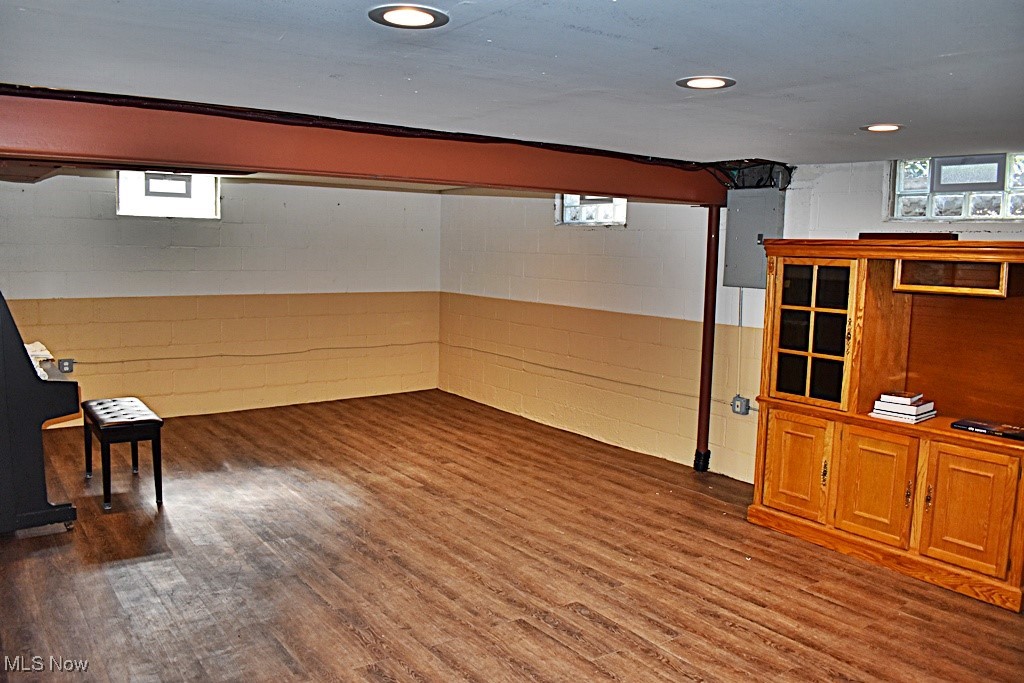 17600 Egbert Road Bedford, OH 44146 - Photo 36 of 49 Below grade area with laminate floors, a wealth of natural light and recessed lighting