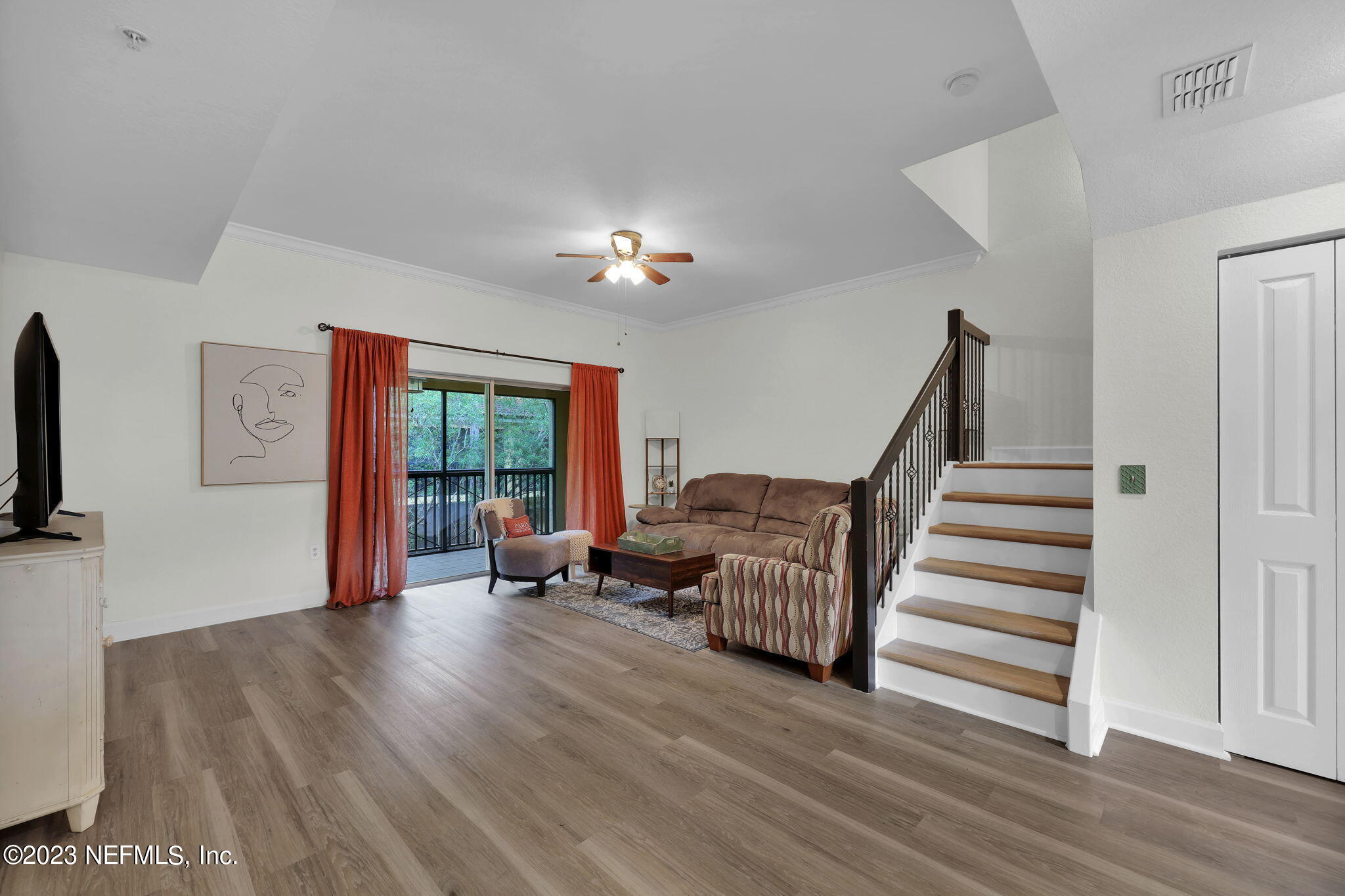 9745 Touchton Road, Unit 428 Jacksonville, FL 32246 - Photo 15 of 40 a living room with furniture and a wooden floor