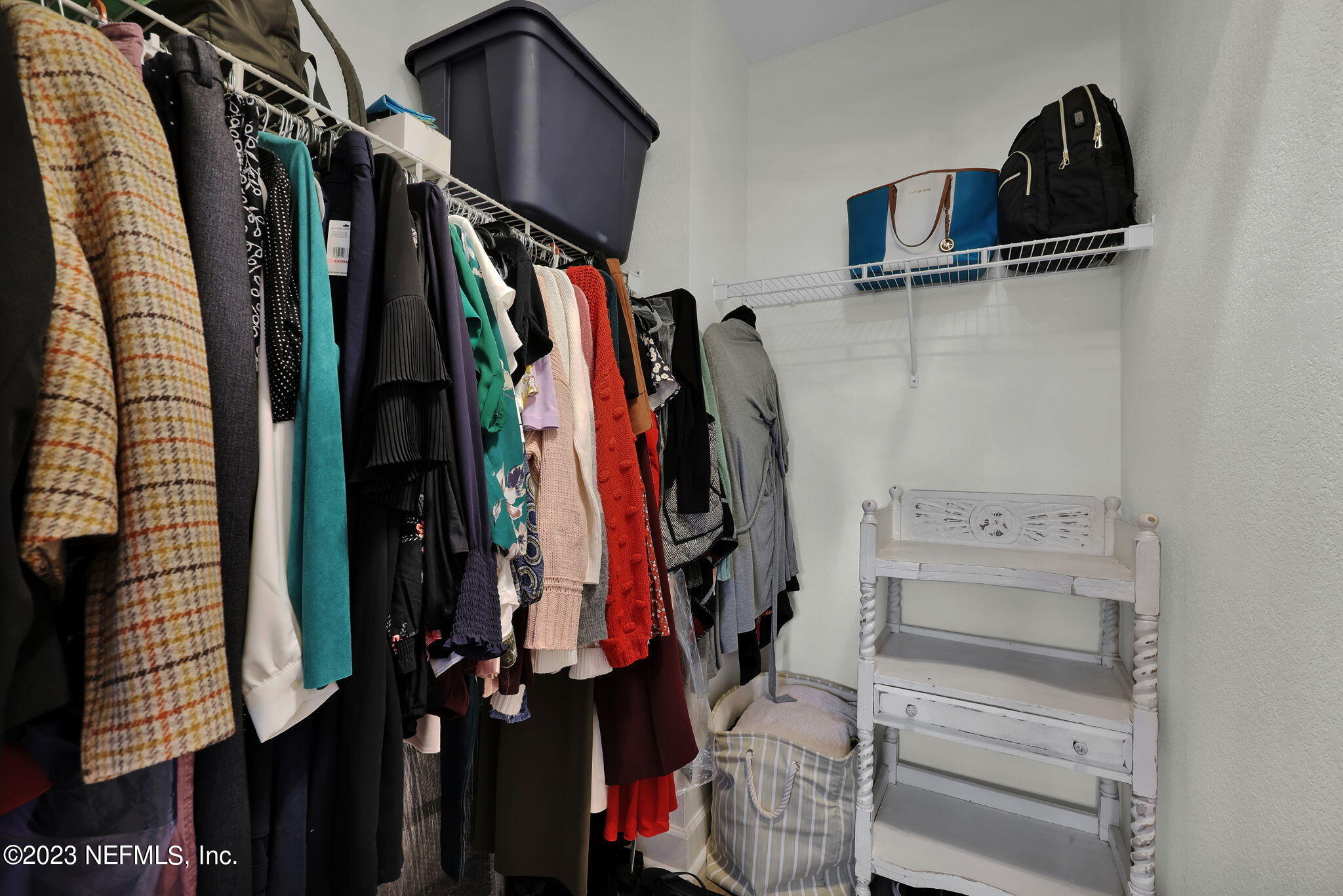 9745 Touchton Road, Unit 428 Jacksonville, FL 32246 - Photo 29 of 40 a view of walk in closet with clothes and shoes
