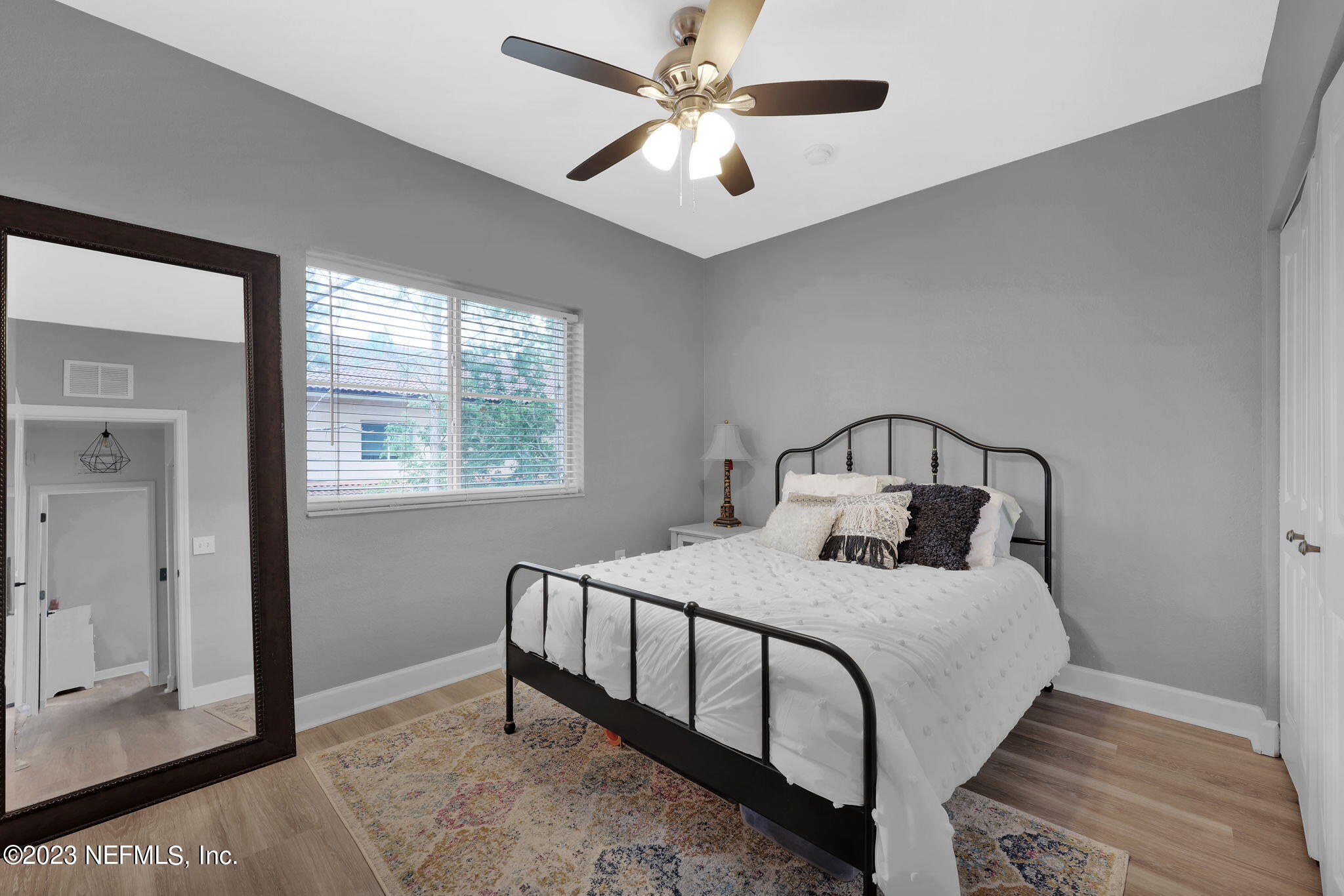 9745 Touchton Road, Unit 428 Jacksonville, FL 32246 - Photo 30 of 40 a bedroom with a bed and a window