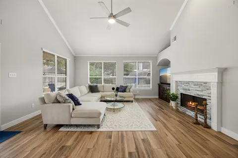 a living room with furniture and a fireplace