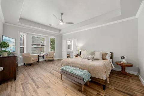 a bedroom with a bed and a couch