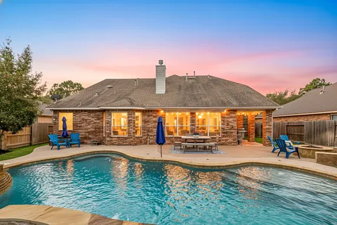 swimming pool view with a outdoor seating