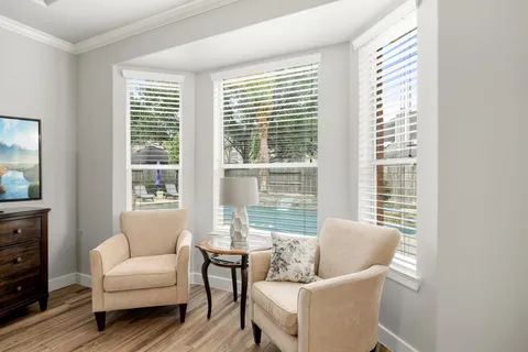 a living room with furniture and windows