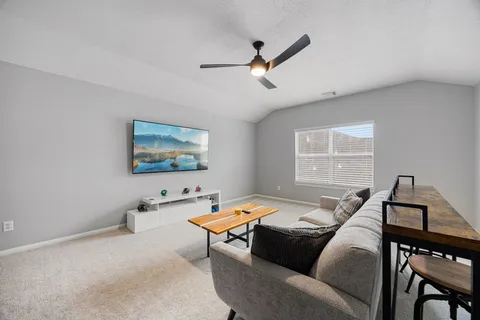 a living room with furniture and a window