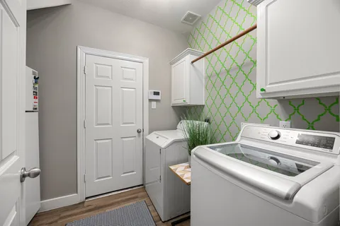 a utility room with dryer and washer
