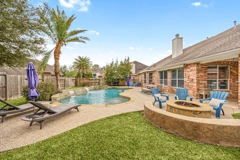 a view of a house with backyard porch and patio