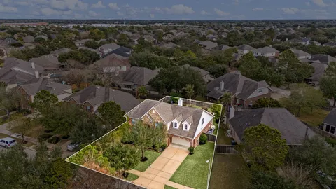 an aerial view of a house with a garden