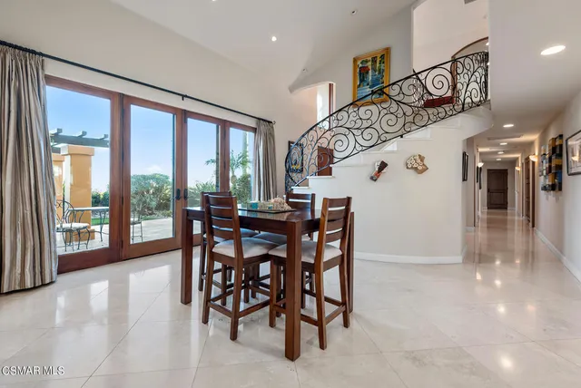a large kitchen with stainless steel appliances lots of counter top space