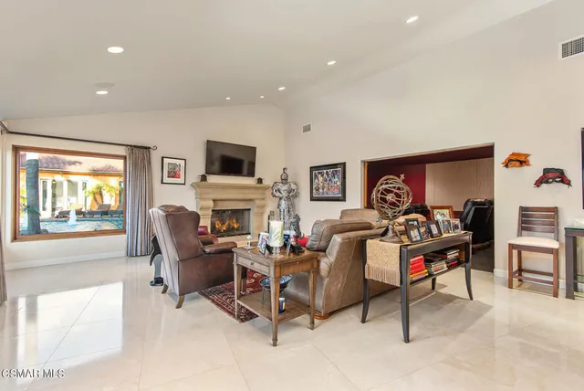a dining room with stainless steel appliances granite countertop a dining table and chairs