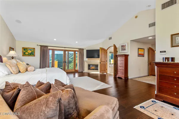 a dining room with fireplace and a large window