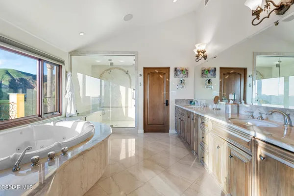 a room with gym equipment and wooden floor