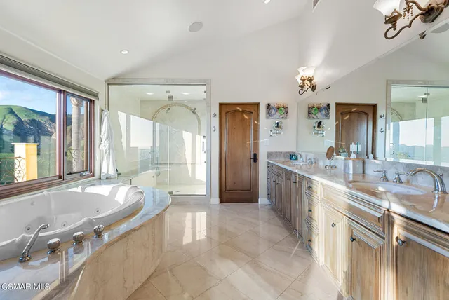 a room with gym equipment and wooden floor