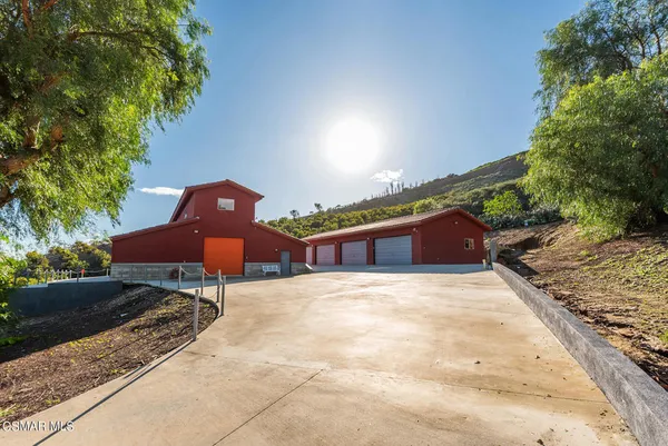 a backyard of a house with a fireplace