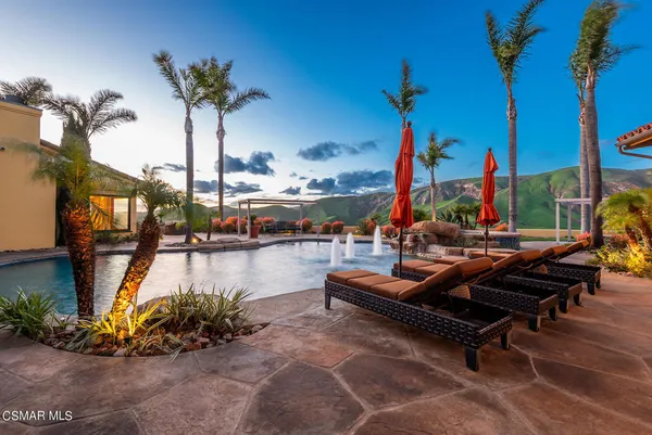 a view of swimming pool with outdoor seating