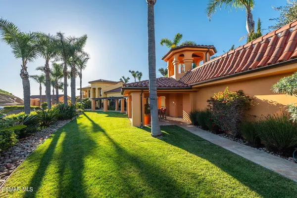 a view of a swimming pool with an outdoor seating