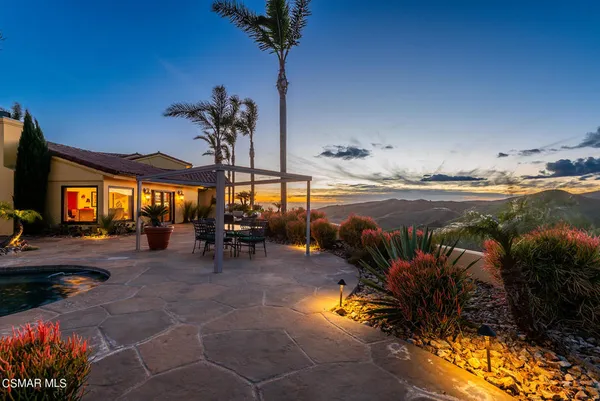 a view of a swimming pool with a lounge chair