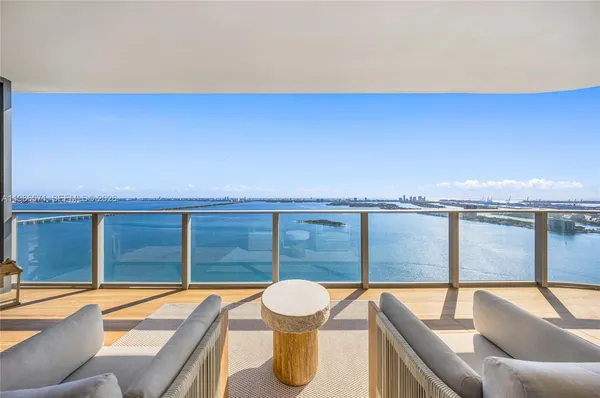 a view of a balcony with an ocean view