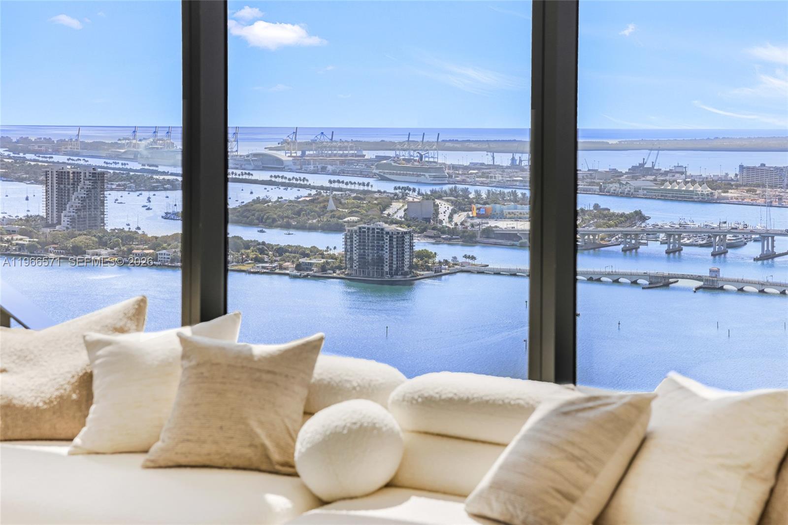 700 Northeast 24th Street, Unit 4007 Miami, FL 33137 - Photo 14 of 100 a bedroom with a large window and a table