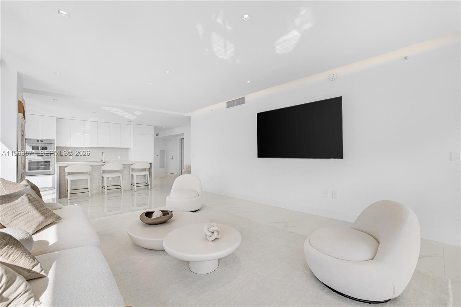 700 Northeast 24th Street, Unit 4007 Miami, FL 33137 - Photo 17 of 100 a living room with furniture and a flat screen tv