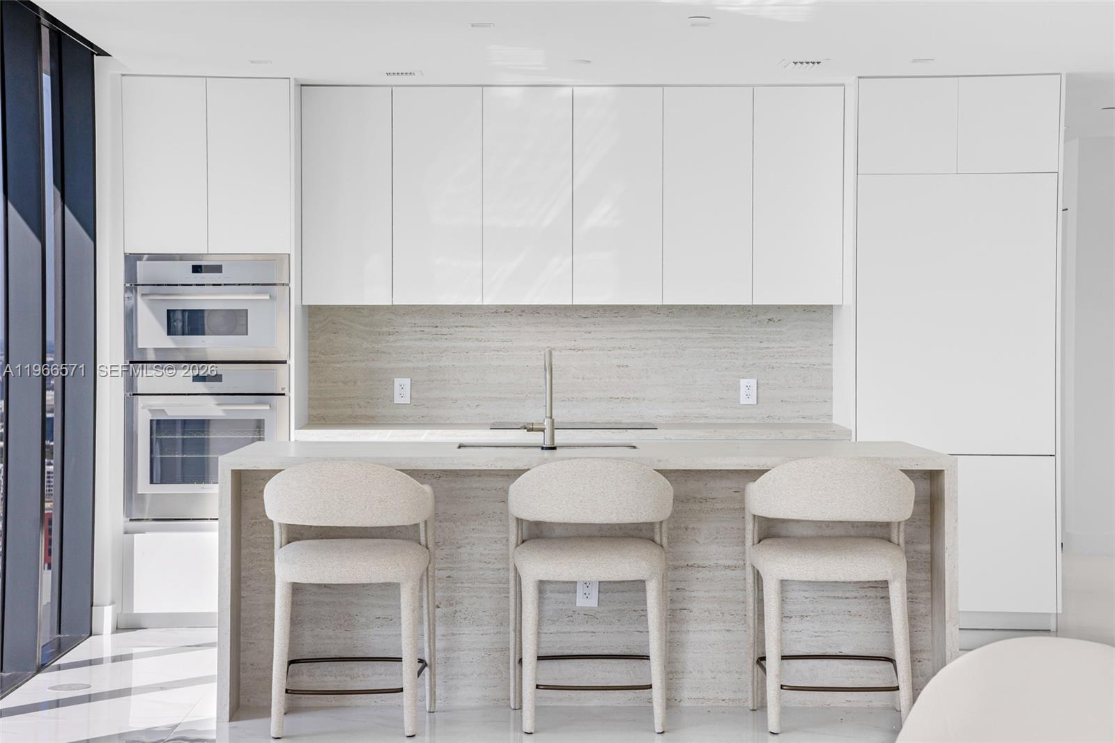 700 Northeast 24th Street, Unit 4007 Miami, FL 33137 - Photo 21 of 100 a kitchen with stainless steel appliances cabinets and a counter top space