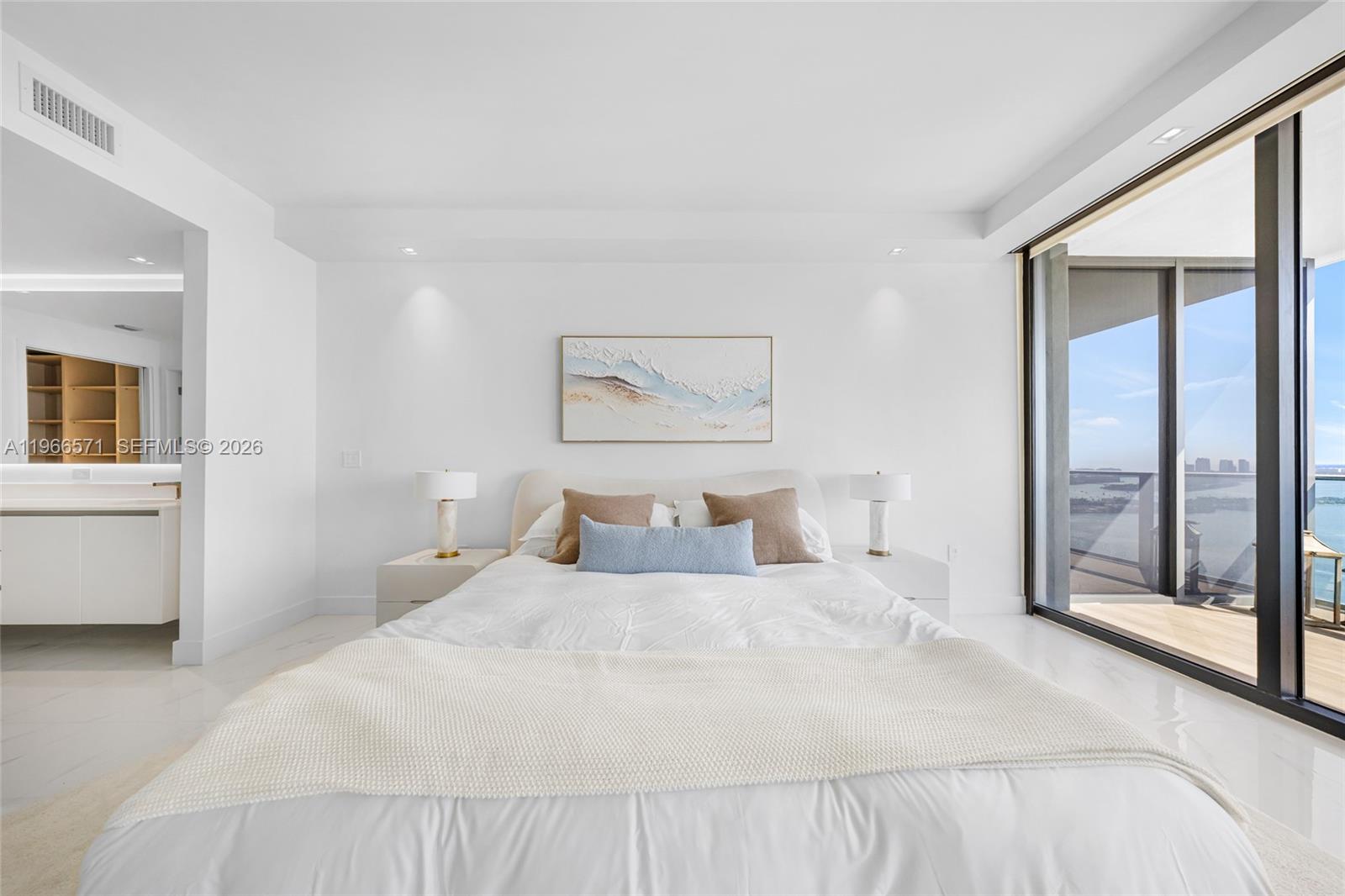 700 Northeast 24th Street, Unit 4007 Miami, FL 33137 - Photo 29 of 100 a bedroom with a large bed and a large window