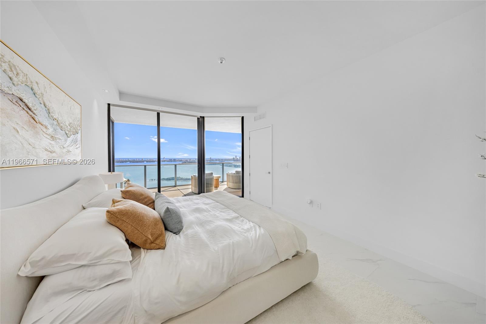 700 Northeast 24th Street, Unit 4007 Miami, FL 33137 - Photo 33 of 100 a large bed sitting in a bedroom next to a window