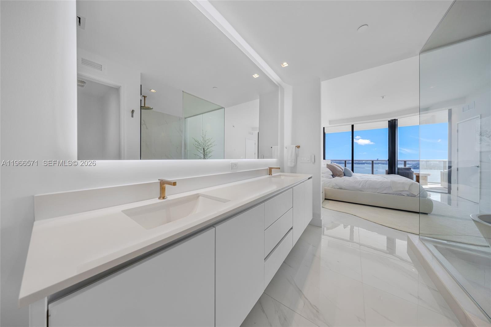 700 Northeast 24th Street, Unit 4007 Miami, FL 33137 - Photo 37 of 100 a spacious bathroom with a double vanity sink and mirror