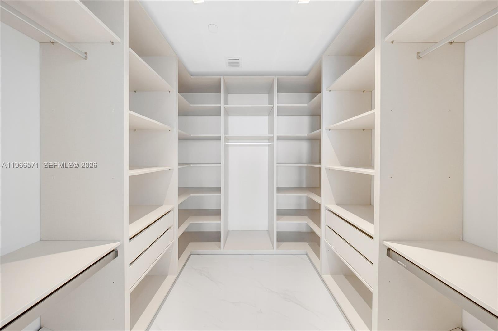 700 Northeast 24th Street, Unit 4007 Miami, FL 33137 - Photo 38 of 100 a view of walk in closet with empty racks