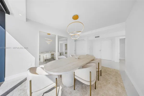 a view of swimming pool with a dining table and chairs