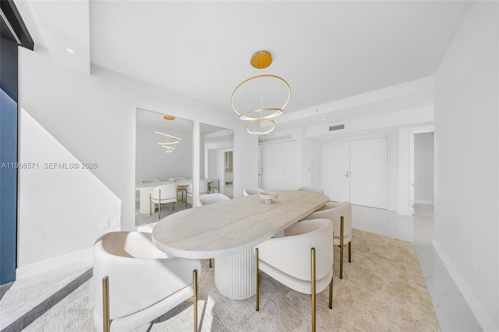 700 Northeast 24th Street, Unit 4007 Miami, FL 33137 - Photo 43 of 100 a view of a dining room with furniture and a chandelier