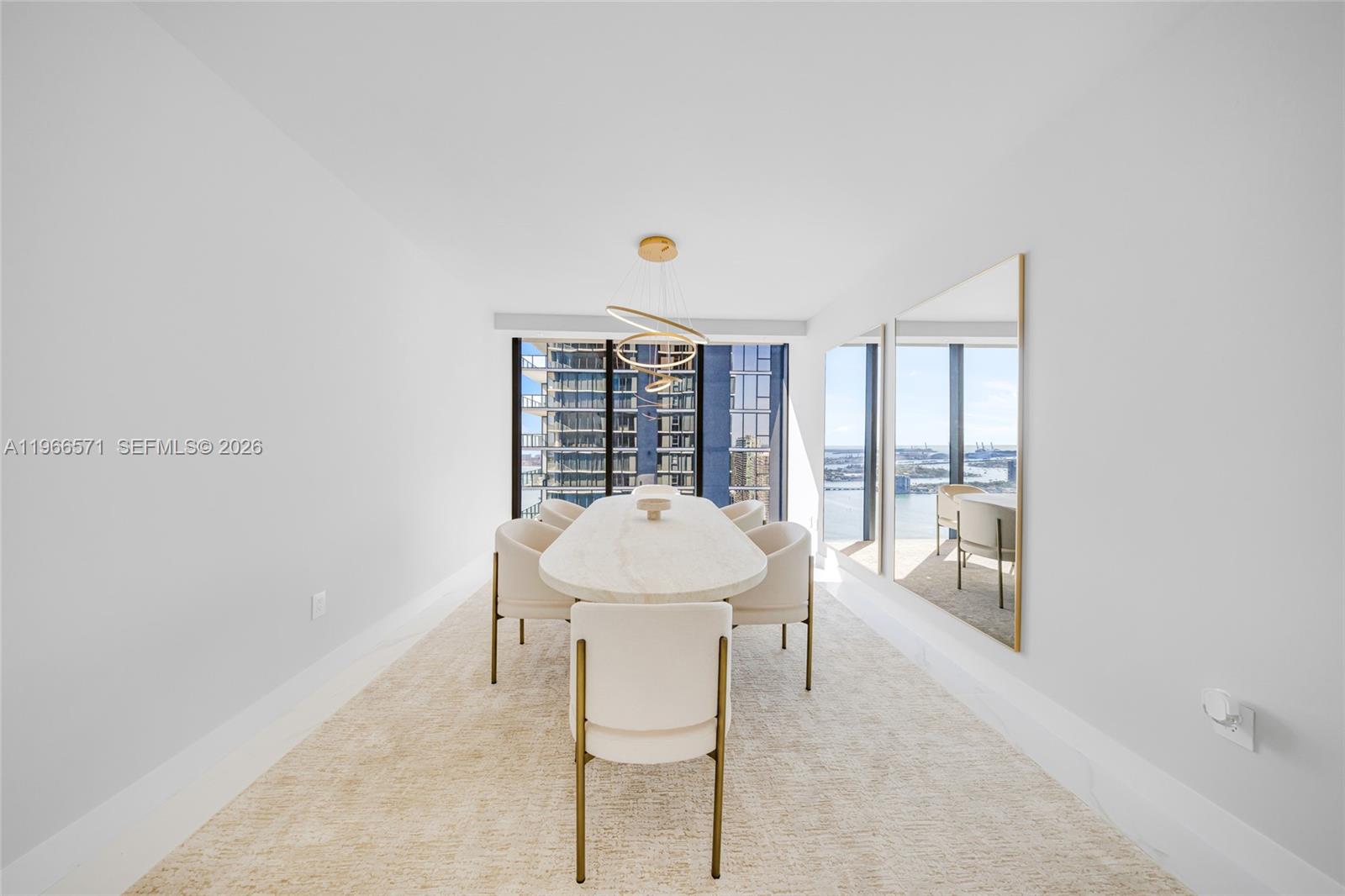 700 Northeast 24th Street, Unit 4007 Miami, FL 33137 - Photo 44 of 100 a living room with furniture a window and a table