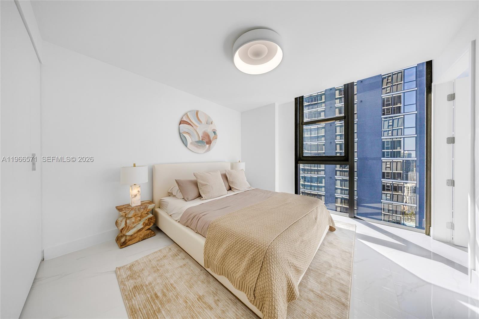 700 Northeast 24th Street, Unit 4007 Miami, FL 33137 - Photo 45 of 100 a bedroom with a bed and a window