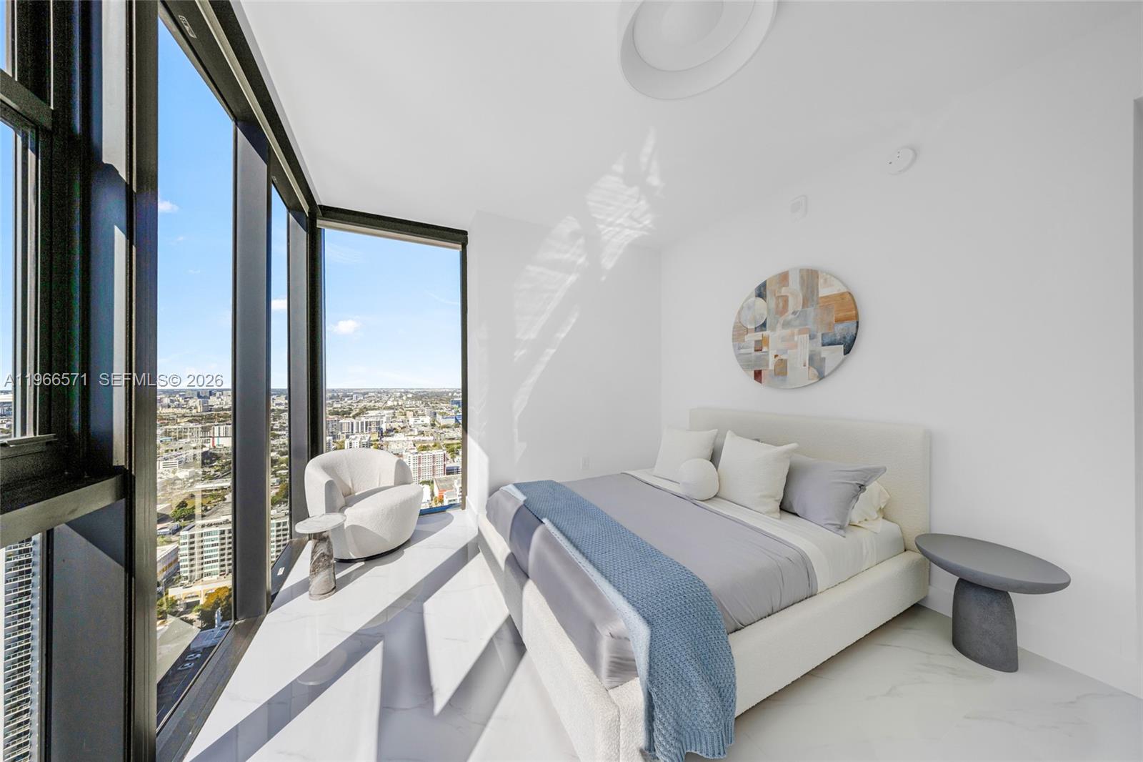 700 Northeast 24th Street, Unit 4007 Miami, FL 33137 - Photo 53 of 100 a bedroom with a bed and a large window