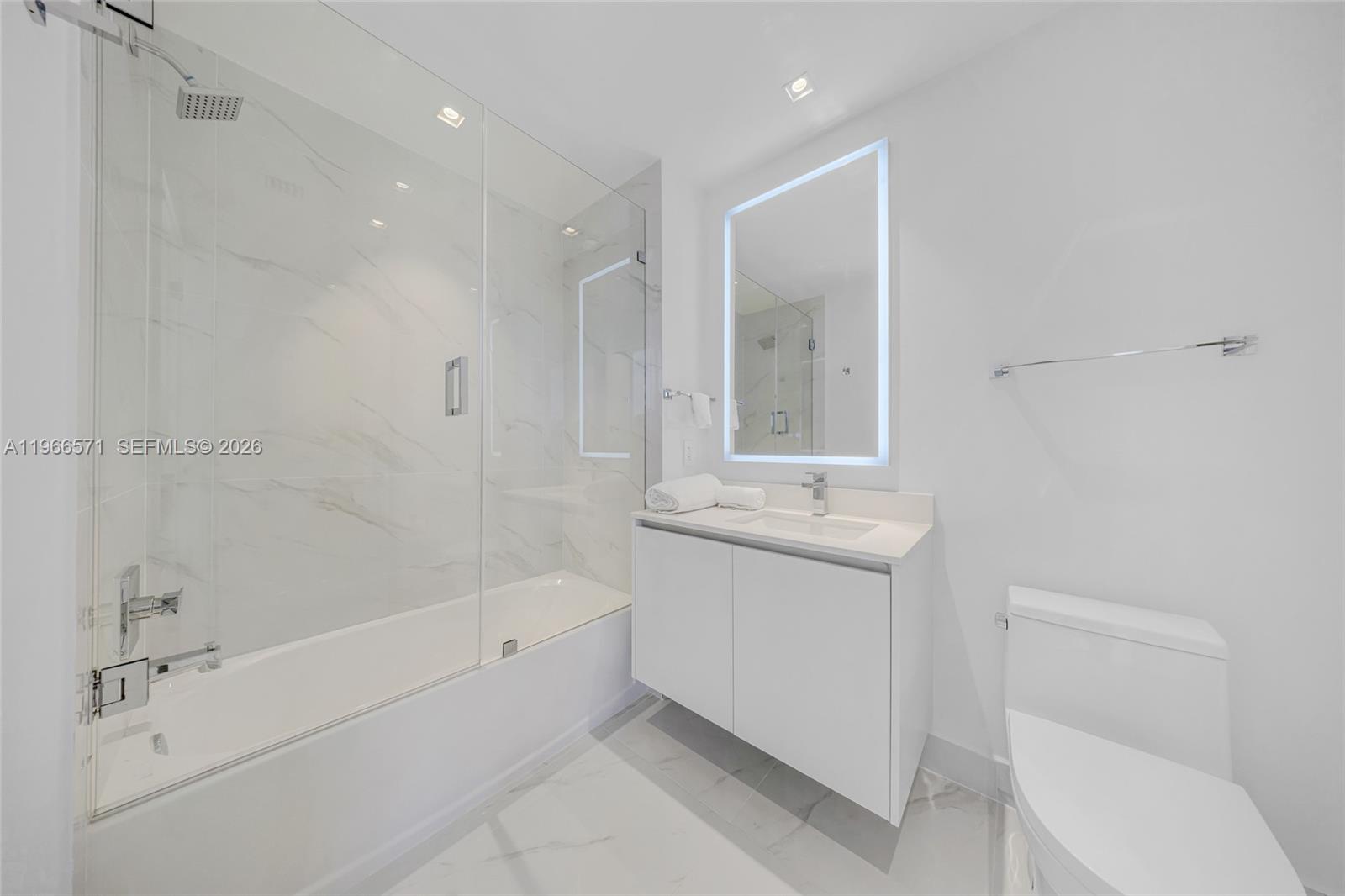 700 Northeast 24th Street, Unit 4007 Miami, FL 33137 - Photo 63 of 100 a bathroom with a sink a toilet and shower