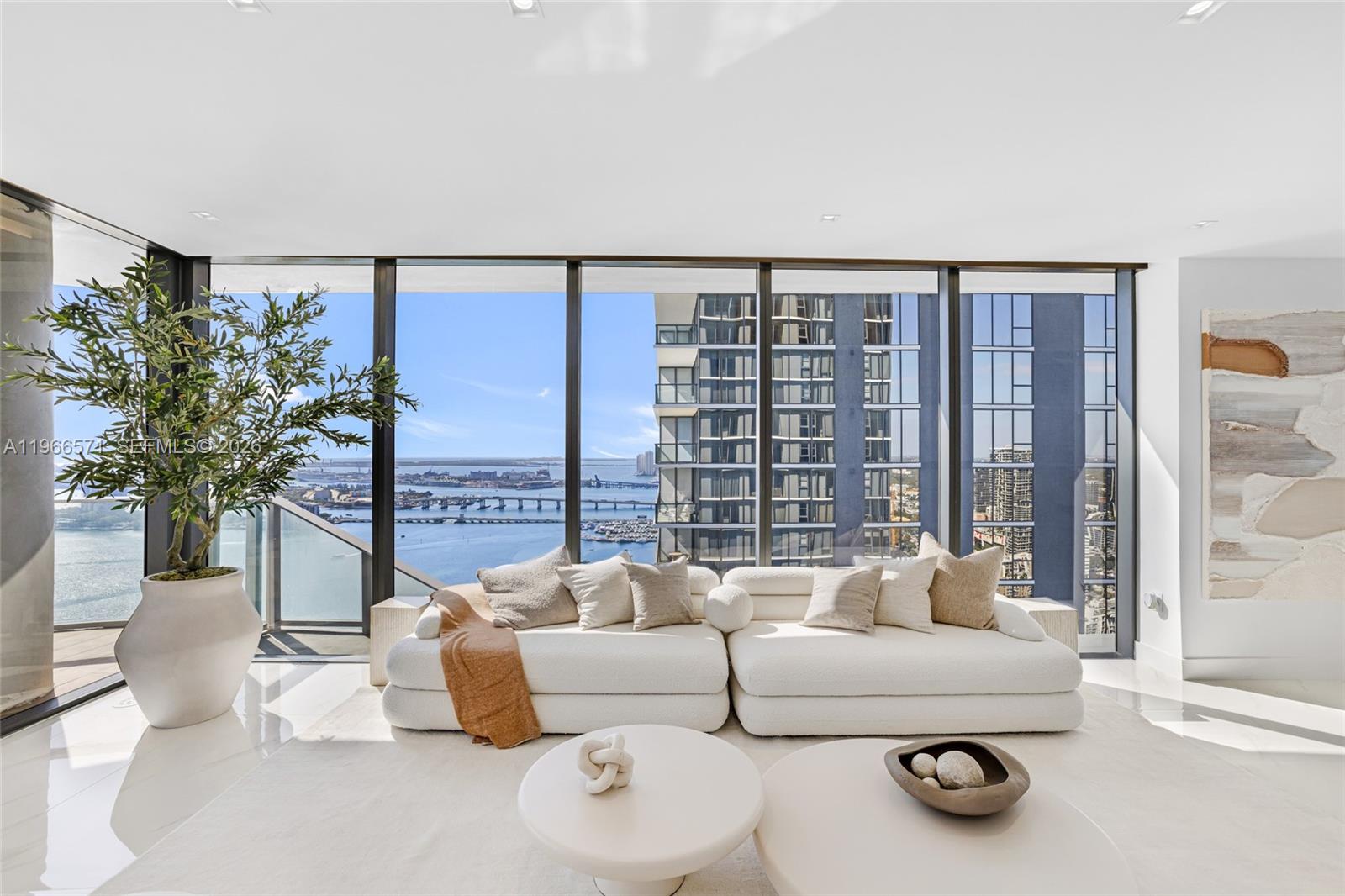 700 Northeast 24th Street, Unit 4007 Miami, FL 33137 - Photo 7 of 100 a living room with furniture and a large window