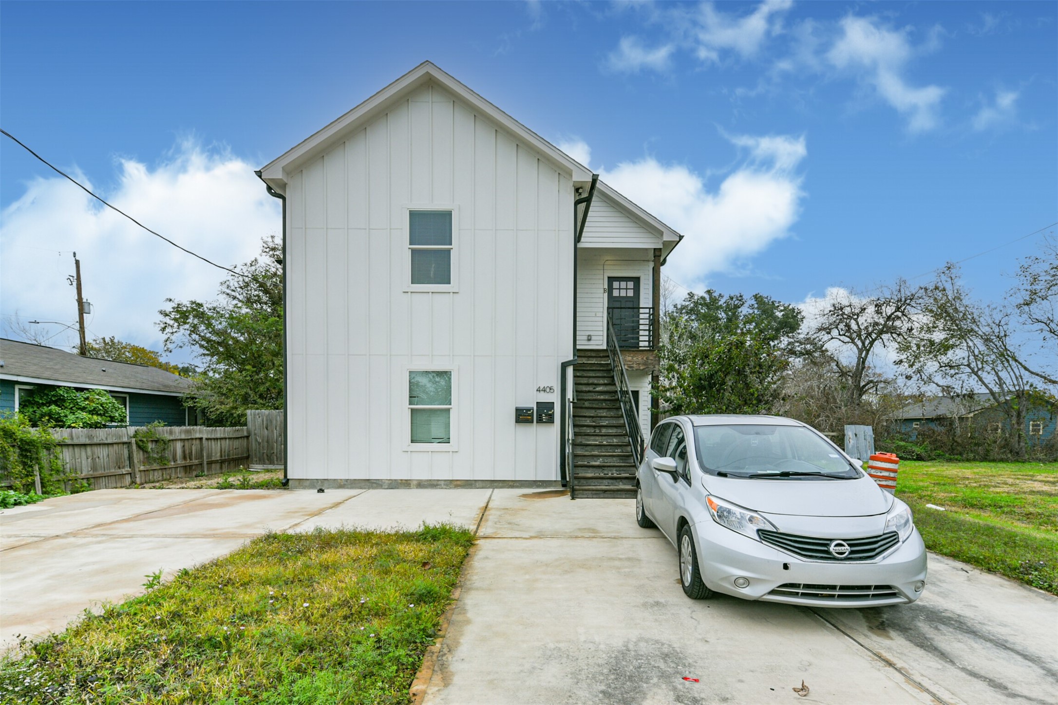 4405 Mallow Street Houston, TX 77051 - Photo 18 of 21 a car parked in front of a house with a yard