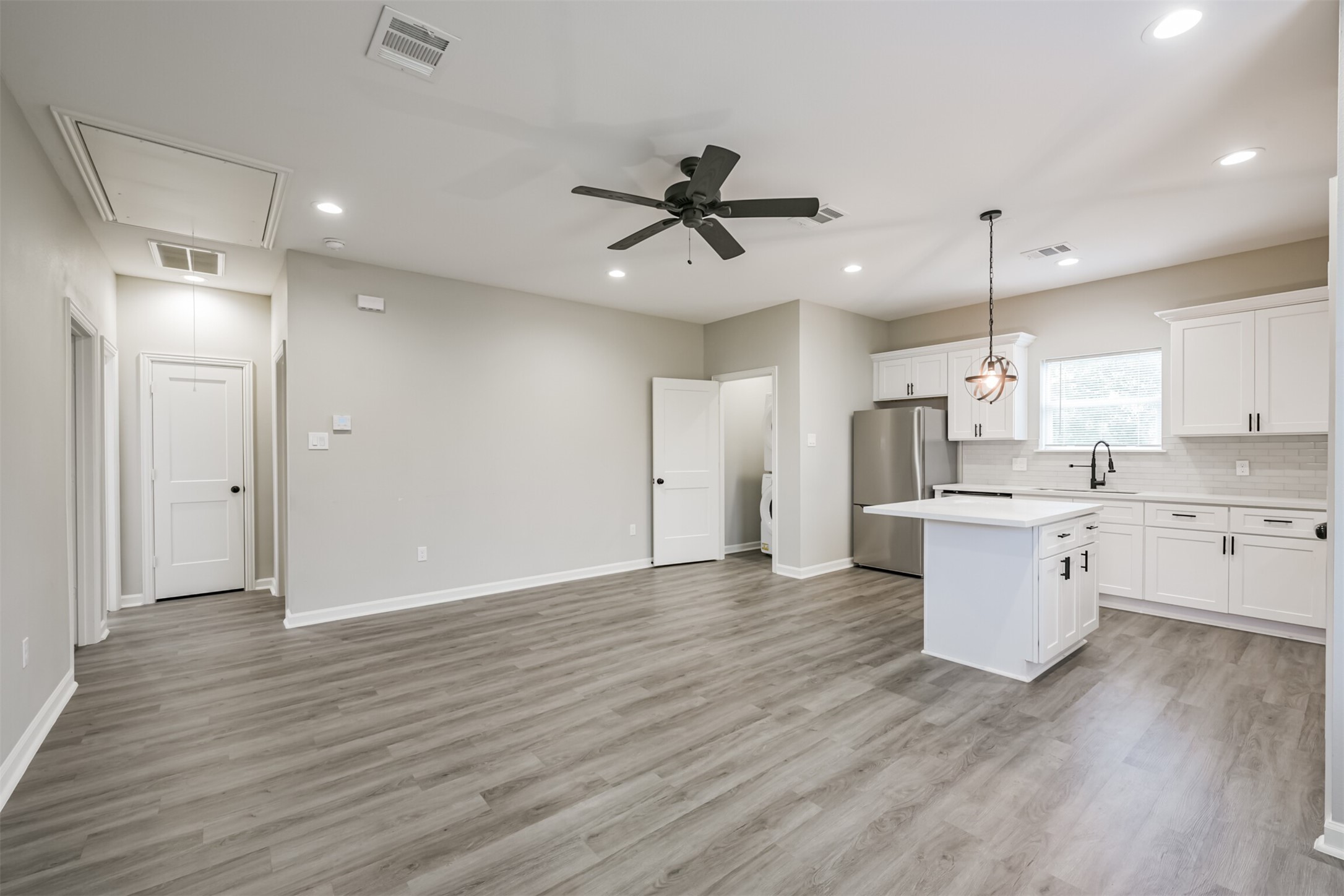 4405 Mallow Street Houston, TX 77051 - Photo 2 of 21 a view of a kitchen with a sink a refrigerator and window