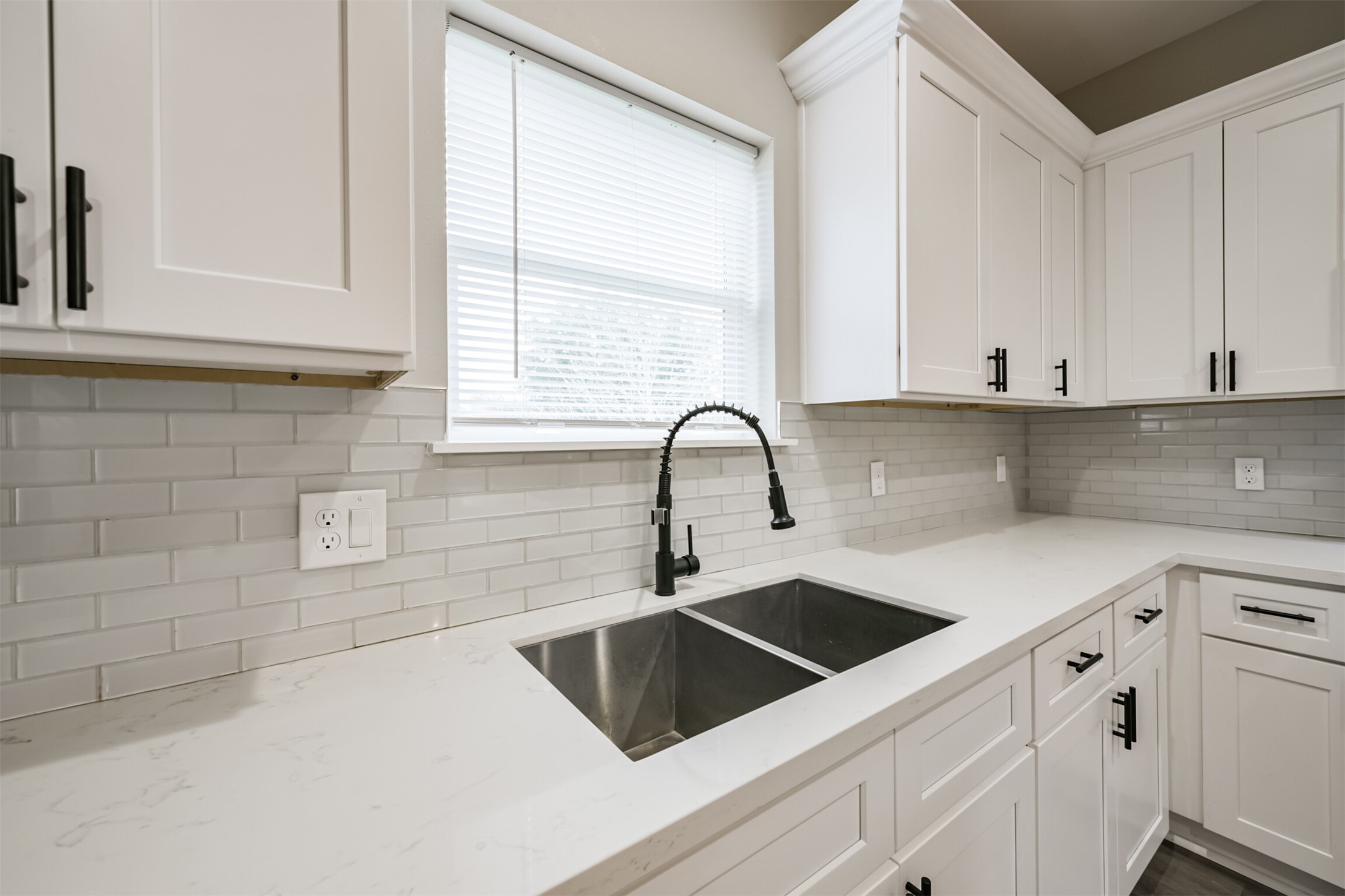4405 Mallow Street Houston, TX 77051 - Photo 6 of 21 a kitchen with granite countertop white cabinets and sink